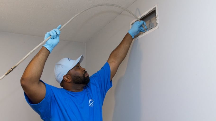 Air duct cleaning worker